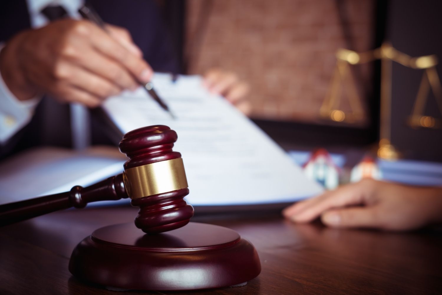 Lawyers with gavel in foreground