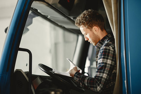 trucker preparing way bill paperwork