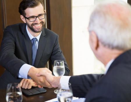 shaking hands with a legal funding specialist from Balanced Bridge Funding