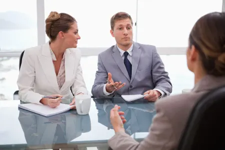 attorneys discussing settlement terms